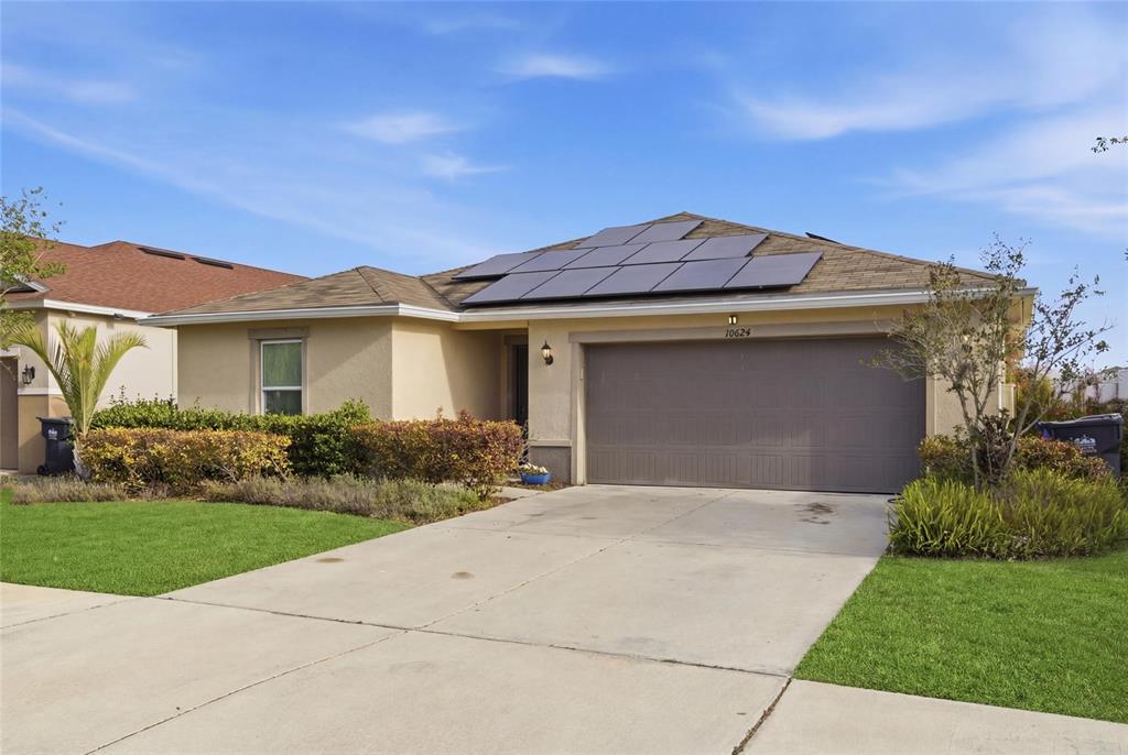 An empty room with light gray walls, tile flooring, and a window with white curtains — 10624 MASSIMO DRIVE, WIMAUMA, FL