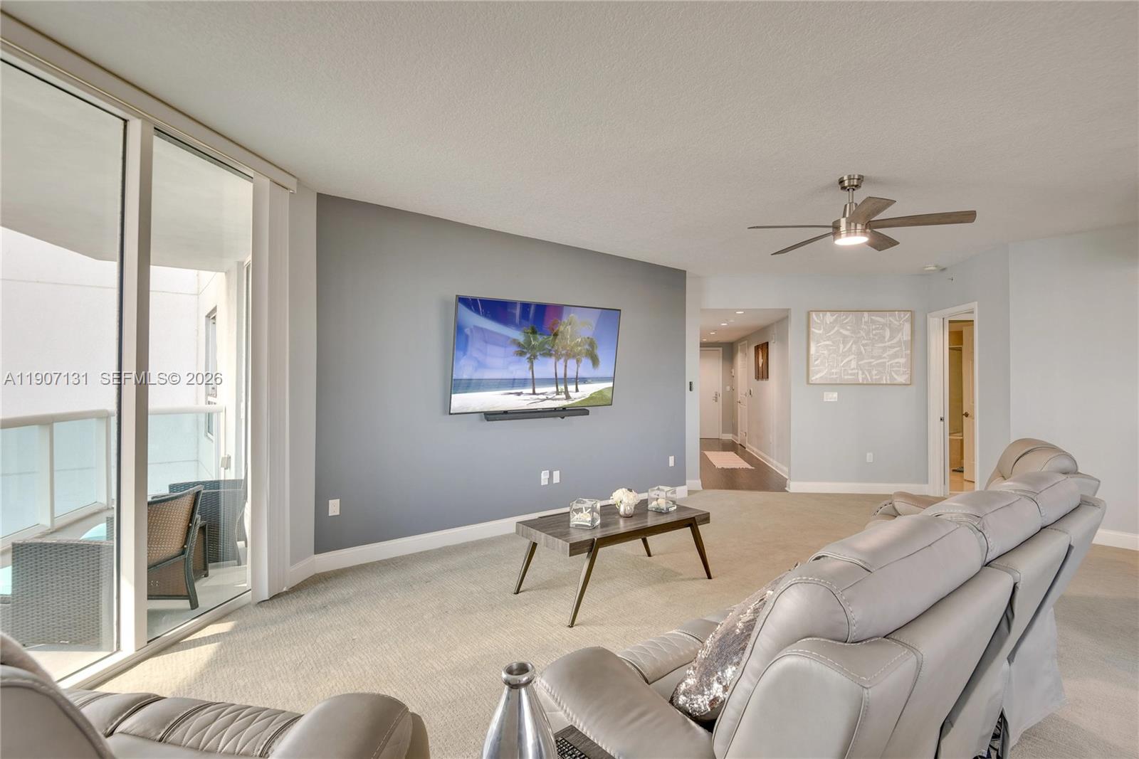 A dining room features a wooden table, six dark chairs, and a large window — 231 Riverside Dr # 510, Daytona FL 32117, DAYTONA, FL