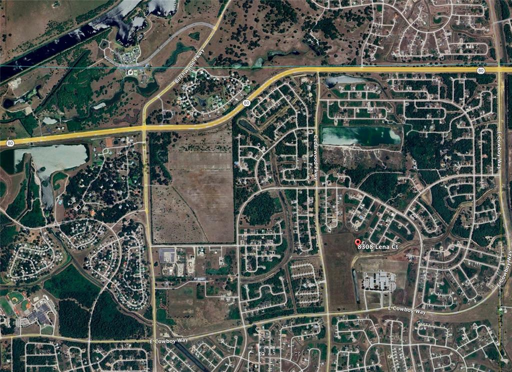 This is an aerial map view of a residential neighborhood and surrounding undeveloped land — 8308 LENA COURT, LABELLE, FL