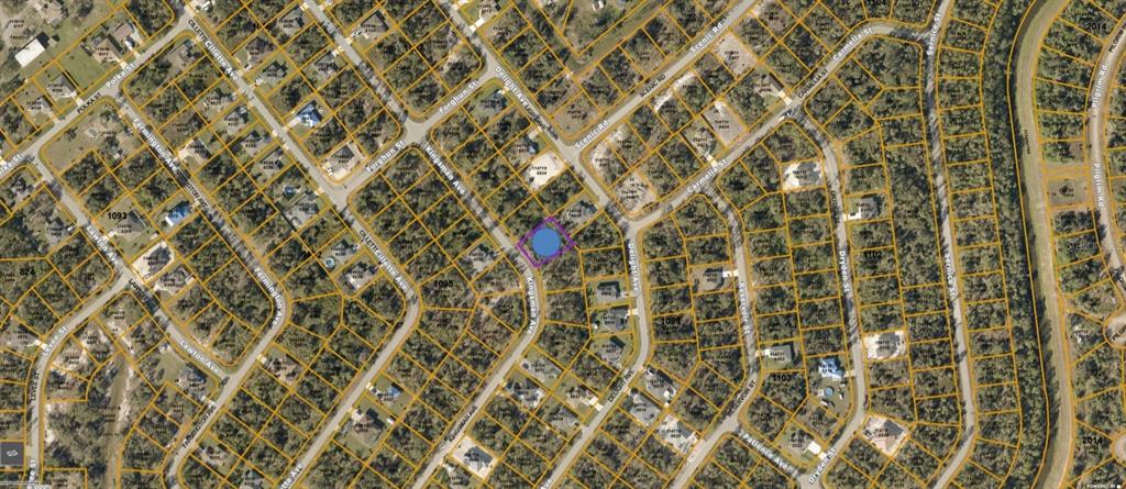 This is an aerial map view of a residential neighborhood with a highlighted property lot — KINGSMAN AVENUE, NORTH PORT, FL