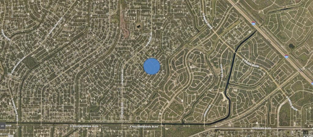 This is an aerial map view of a residential neighborhood with a blue location marker — KINGSMAN AVENUE, NORTH PORT, FL