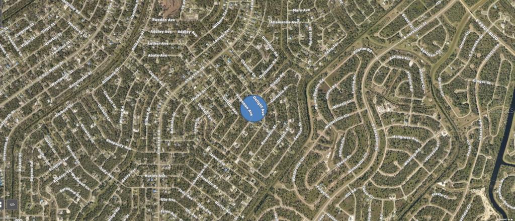 This is an aerial map view of a residential neighborhood with a blue location marker — KINGSMAN AVENUE, NORTH PORT, FL