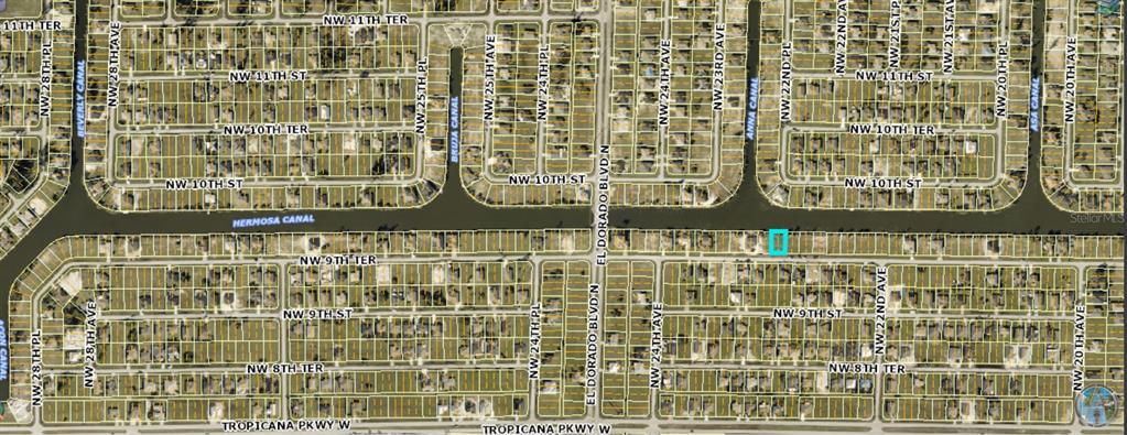 This is a map showing a residential property highlighted in blue along a canal — 2229 NW 9TH TERRACE, CAPE CORAL, FL