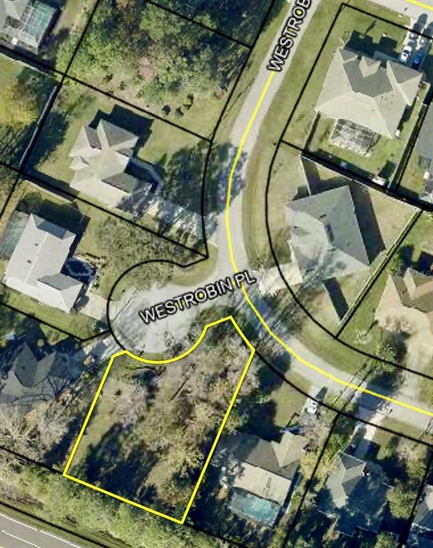 This is an aerial map showing a vacant residential lot outlined in yellow on a cul-de-sac — 1 WESTROBIN PLACE, PALM COAST, FL