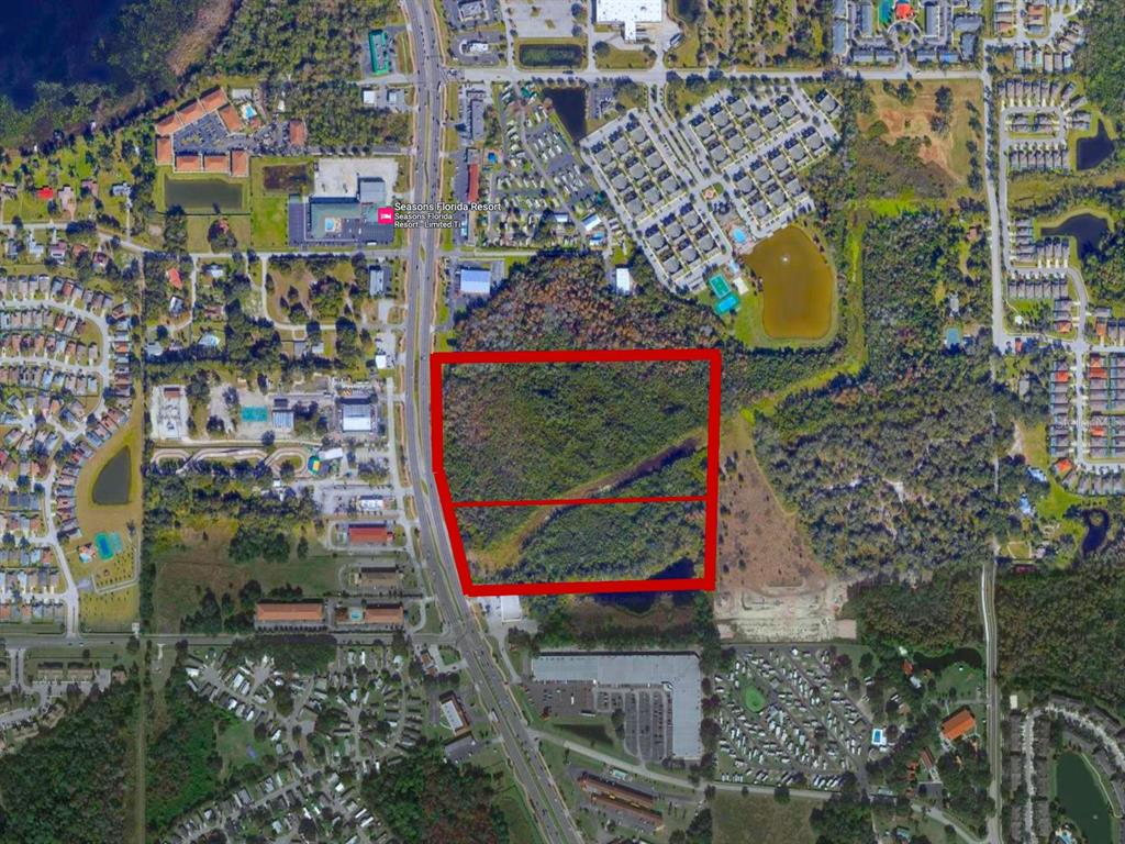 An aerial map view shows a rectangular wooded lot outlined in red near a highway — W IRLO BRONSON MEMORIAL HIGHWAY, KISSIMMEE, FL