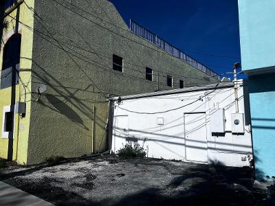 A yellow building with a white single-story extension and a small gravel parking area — 109 SE 15th Terrace, Deerfield Beach FL 33441, DEERFIELD BEACH, FL
