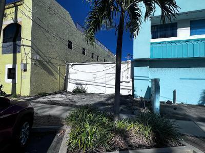 An empty gravel lot sits between a yellow building and a blue building — 109 SE 15th Terrace, Deerfield Beach FL 33441, DEERFIELD BEACH, FL