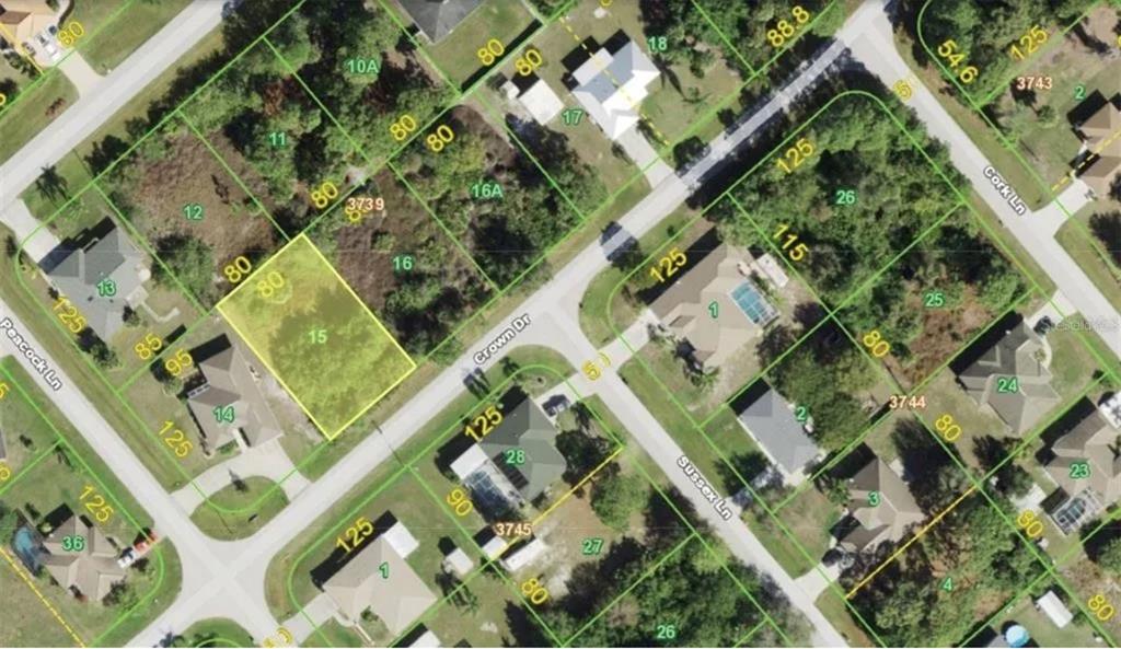 This is an aerial map showing a vacant lot highlighted in yellow among residential properties — 7149 CROWN DRIVE, ENGLEWOOD, FL