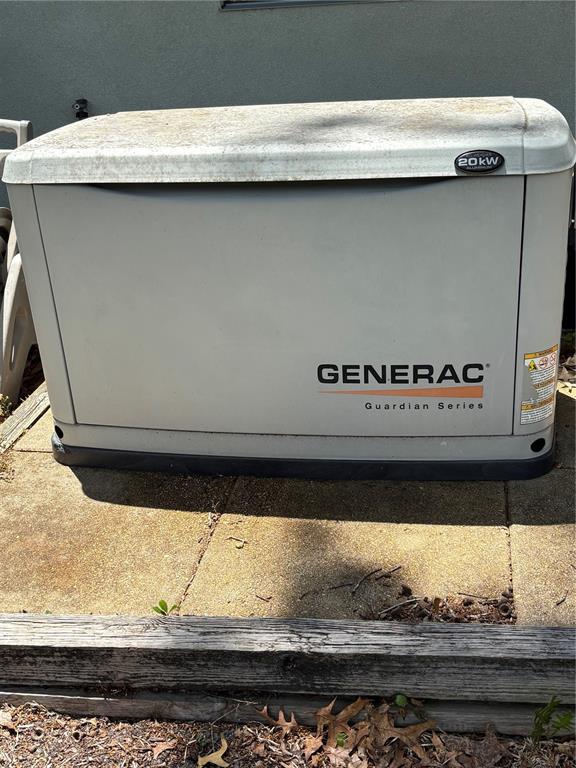 A Generac Guardian Series 20kW standby generator sits on a concrete pad outdoors — 5 CHINKAPIN CIRCLE, HOMOSASSA, FL