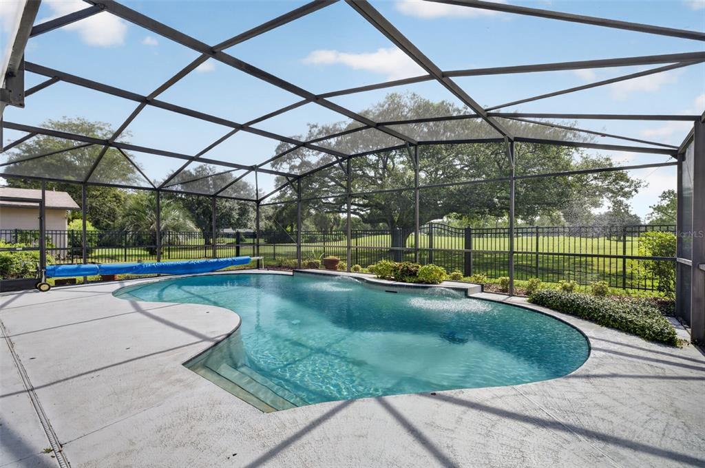 This floor plan shows a house with three bedrooms, a pool, and an attached garage — 938 GOLFSIDE DRIVE, WINTER PARK, FL