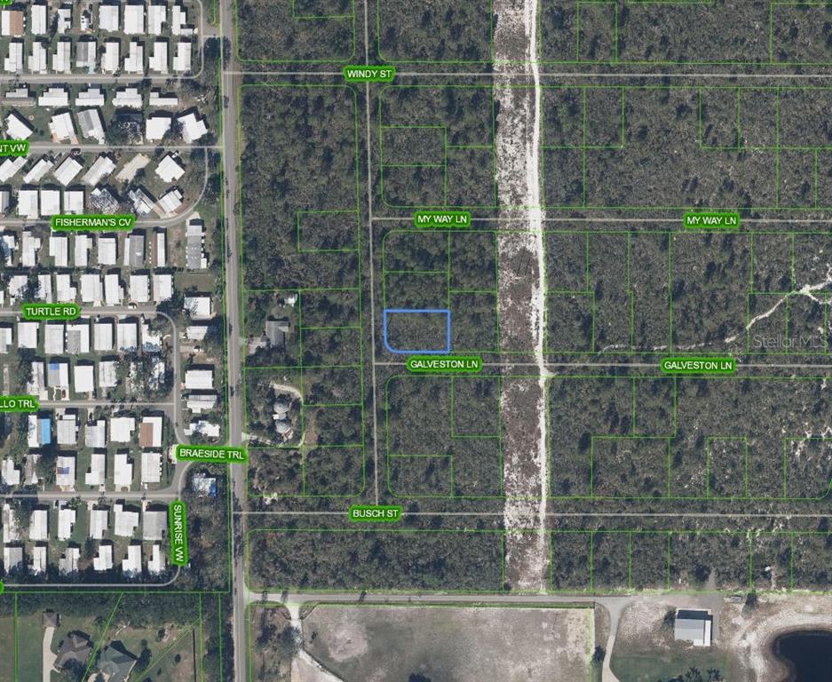 This is a map showing a vacant lot highlighted in blue within a wooded area — 412 RESPECT DRIVE, LAKE PLACID, FL