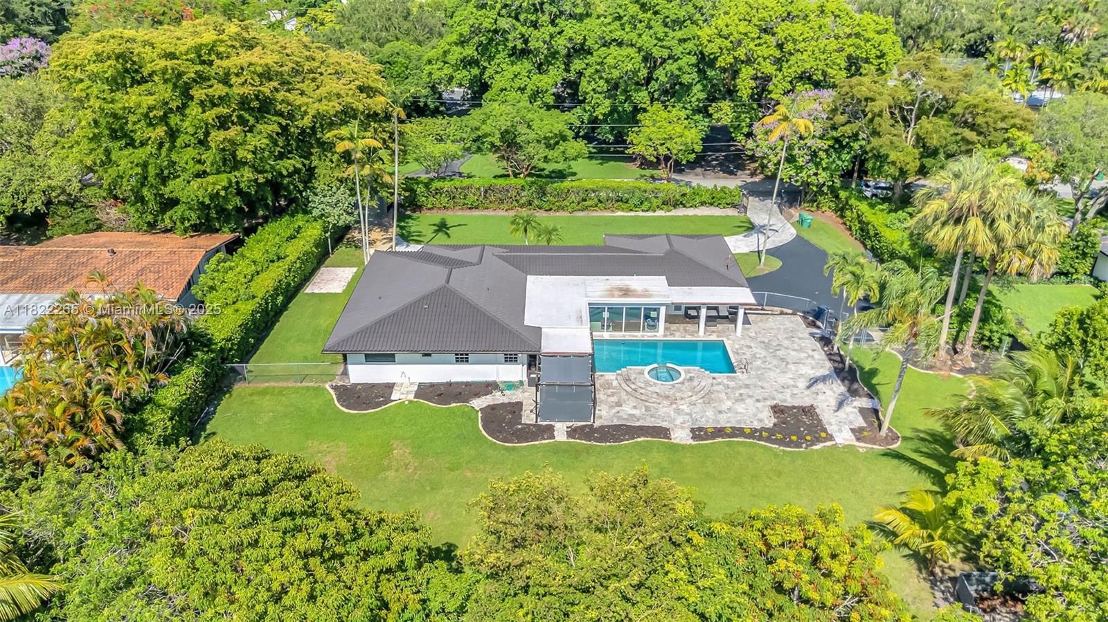 An aerial view shows a single-story house with a dark roof, pool, and large backyard — 11230 SW 69th Ct, Pinecrest FL 33156, PINECREST, FL