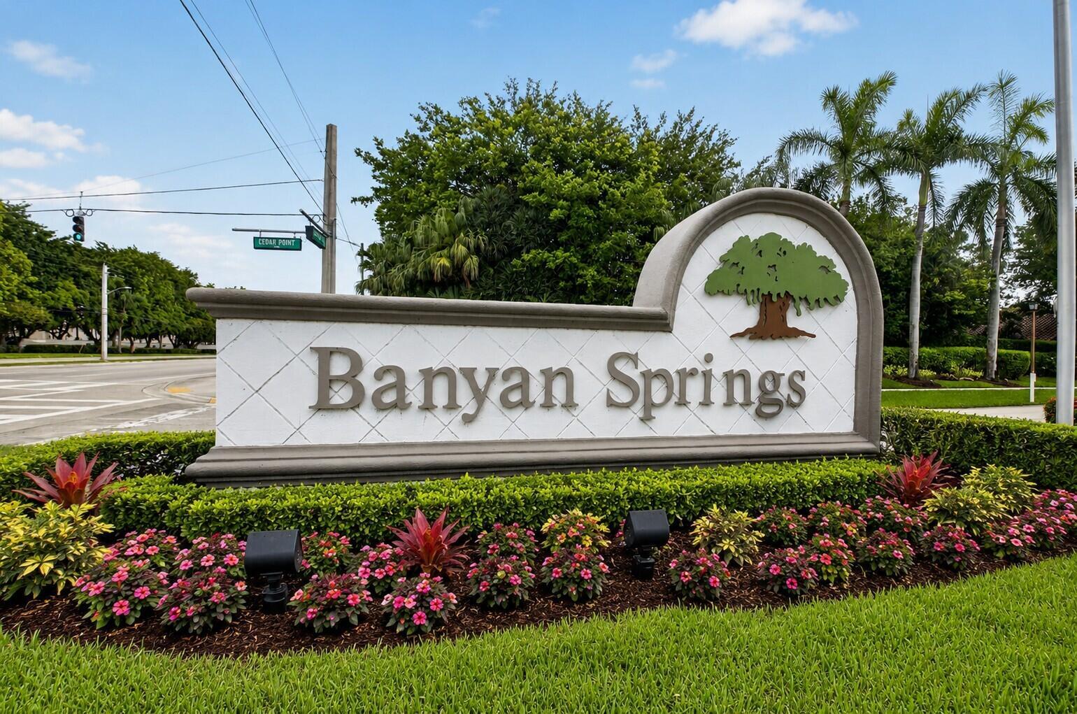 A stone monument sign for Banyan Springs sits in a landscaped garden with palm trees — 10039 53rd Way S # 2303, Boynton Beach FL 33437, BOYNTON BEACH, FL