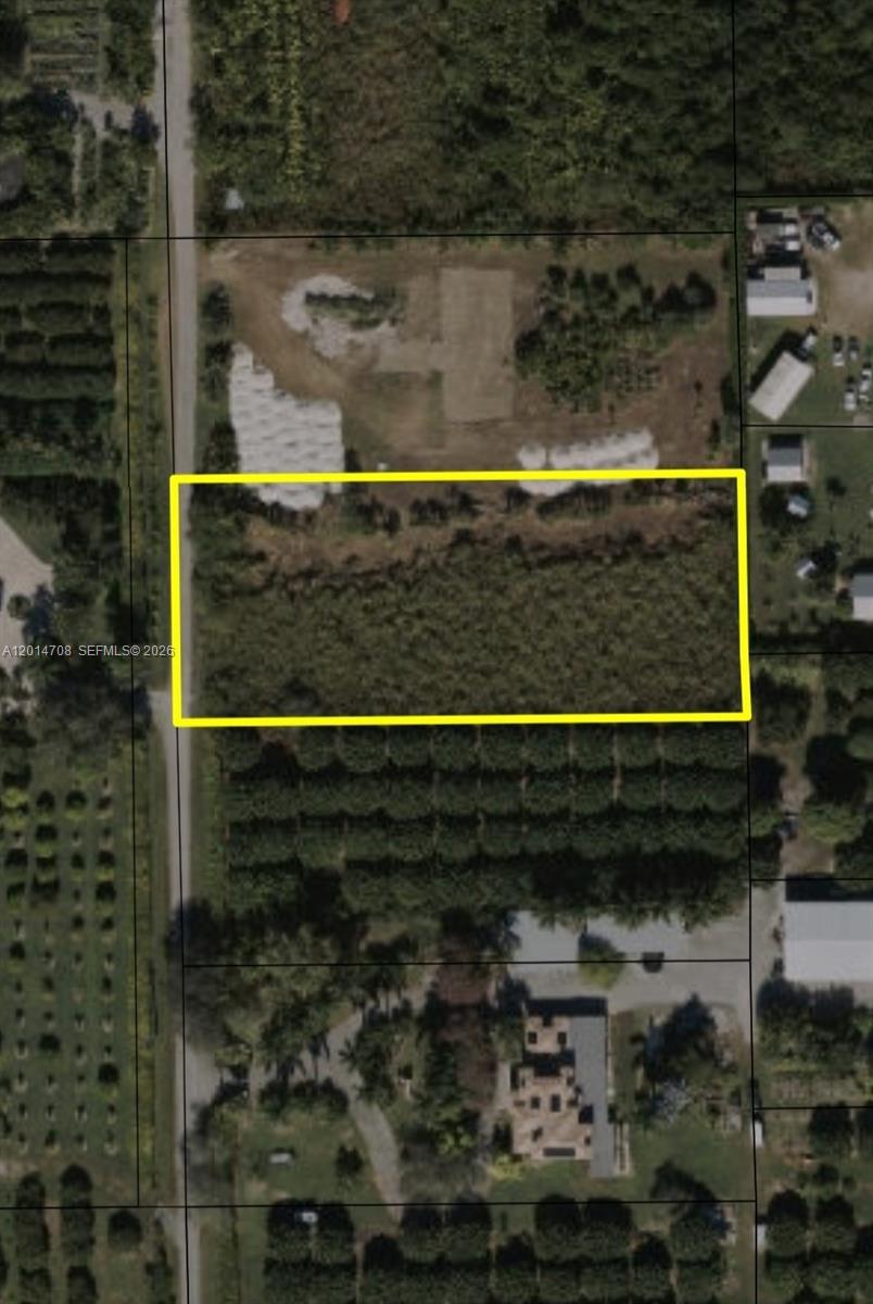 An aerial view shows a rectangular plot of land outlined in yellow next to a road — 0, Homestead FL 33030, HOMESTEAD, FL