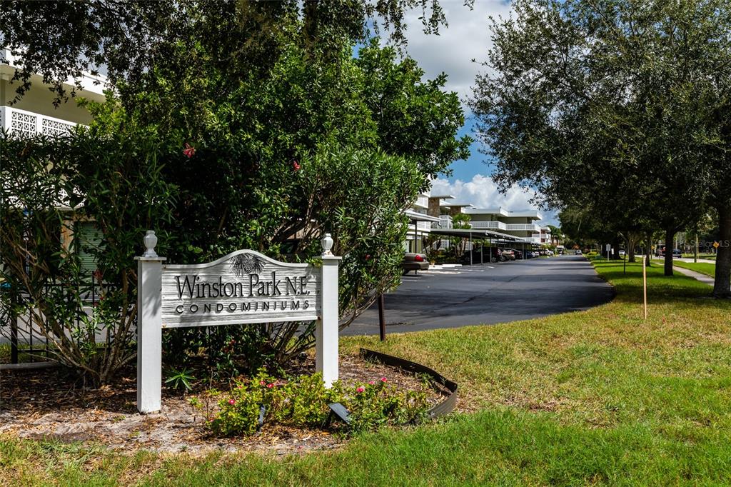 A sign for Winston Park N.E. Condominiums stands in front of a residential apartment complex — 4715 BAY STREET NE UNIT 222, ST PETERSBURG, FL