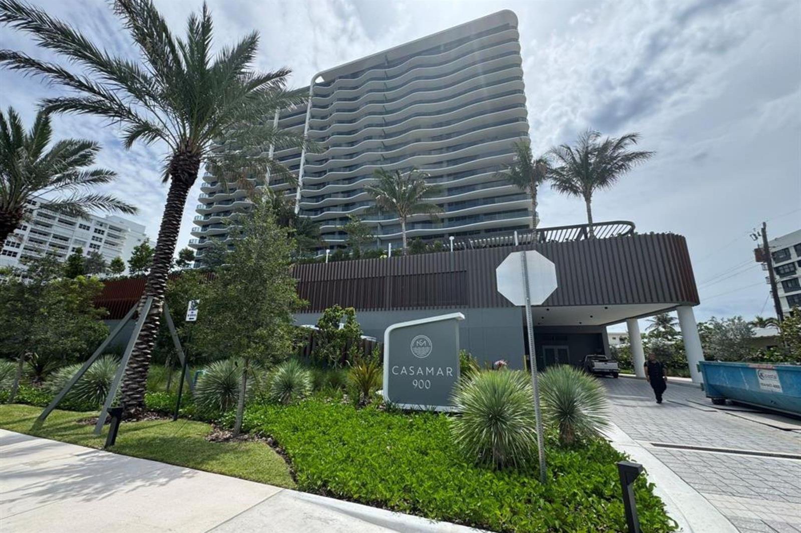 A modern high-rise residential building features wavy balconies and a prominent Casamar 900 entrance sign — 900 N Ocean Boulevard, Pompano Beach FL 33062, POMPANO BEACH, FL