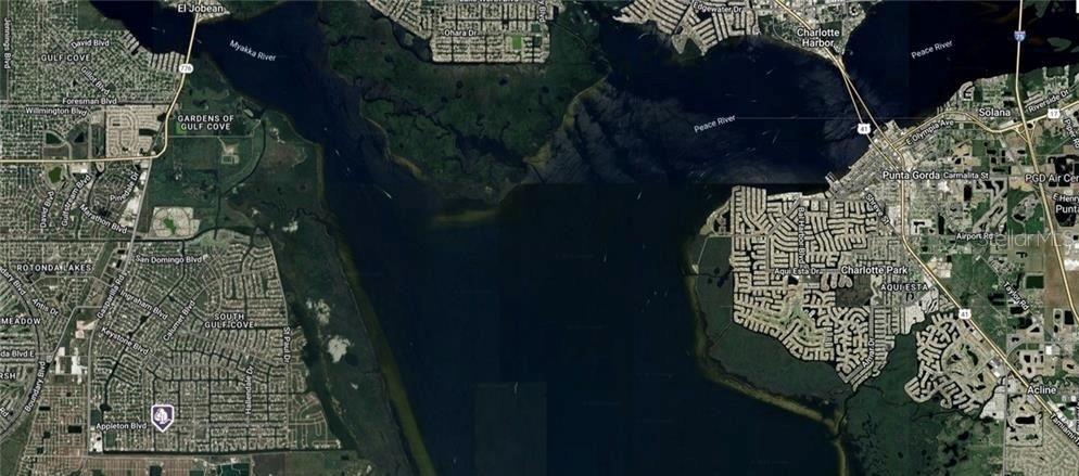 This is a satellite map view of the Charlotte Harbor area in Florida — 10884 MCALESTER CIRCLE, PORT CHARLOTTE, FL