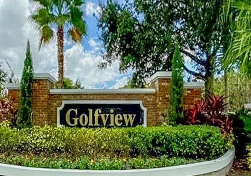 A brick monument sign with the word Golfview stands behind a manicured hedge and landscaping — 13524 TURTLE LOOP UNIT 617, ORLANDO, FL