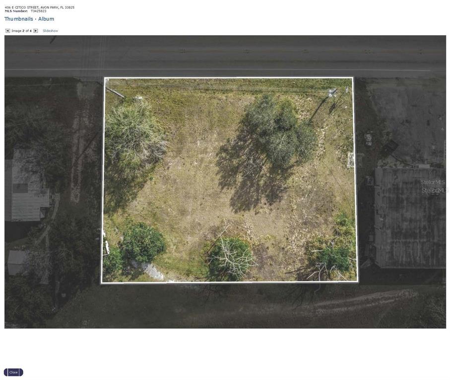 An aerial view shows a rectangular vacant lot with several trees and surrounding structures — 406 E CITICO STREET, AVON PARK, FL