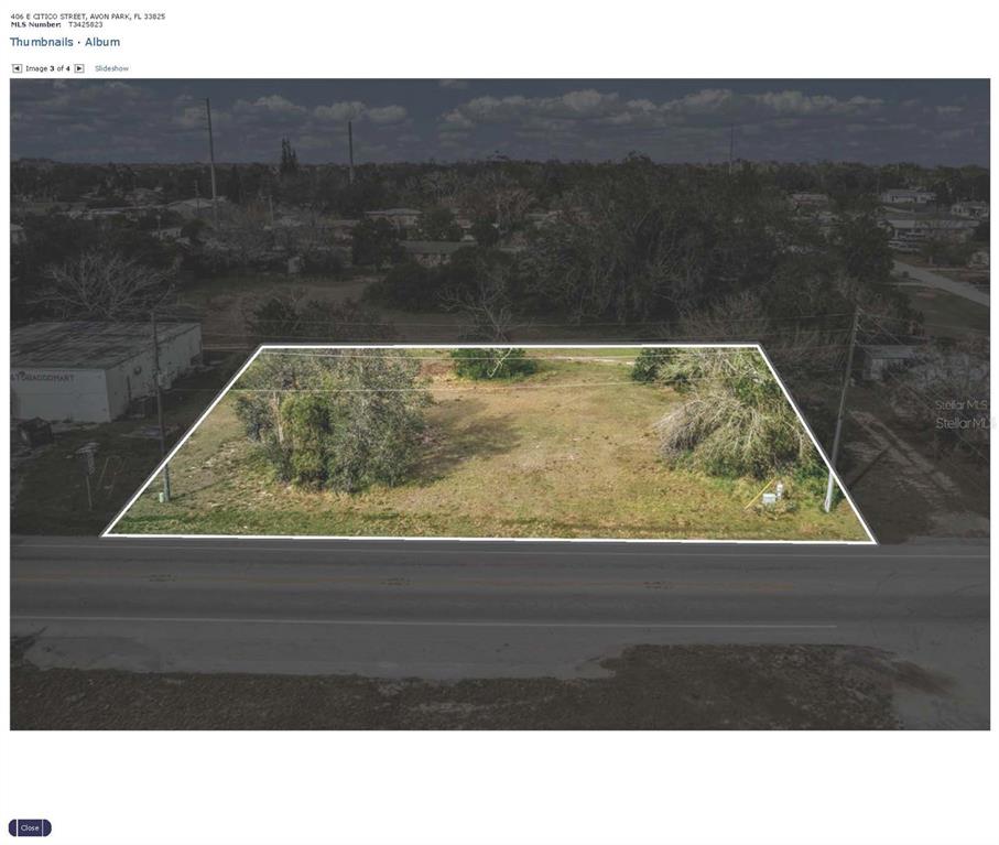 An aerial view shows a vacant, rectangular lot outlined in white along a paved road — 406 E CITICO STREET, AVON PARK, FL