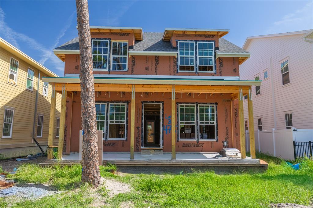 A two-story house under construction with exposed ZIP System sheathing and a front porch — 475 47TH AVENUE N, ST PETERSBURG, FL