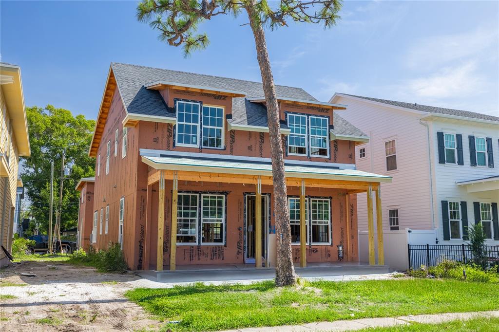 A two-story house under construction with brown exterior sheathing and a front porch — 475 47TH AVENUE N, ST PETERSBURG, FL