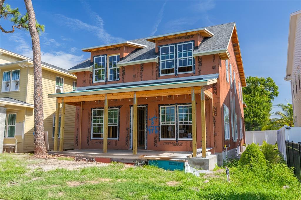 A two-story house under construction with exposed ZIP System sheathing and a front porch — 475 47TH AVENUE N, ST PETERSBURG, FL