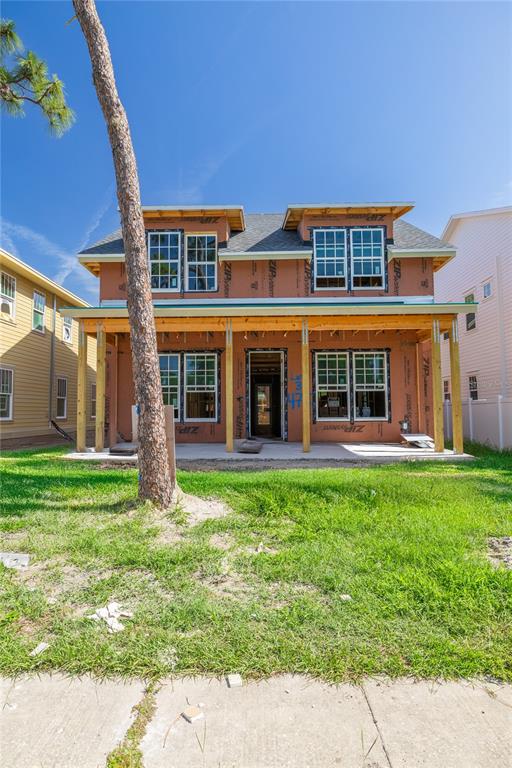 A two-story house under construction features a covered front porch and exposed wood sheathing — 475 47TH AVENUE N, ST PETERSBURG, FL