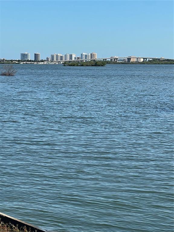 A view of a calm body of water with a bridge and city skyline beyond — 5242 RIVERSIDE DRIVE, PORT ORANGE, FL