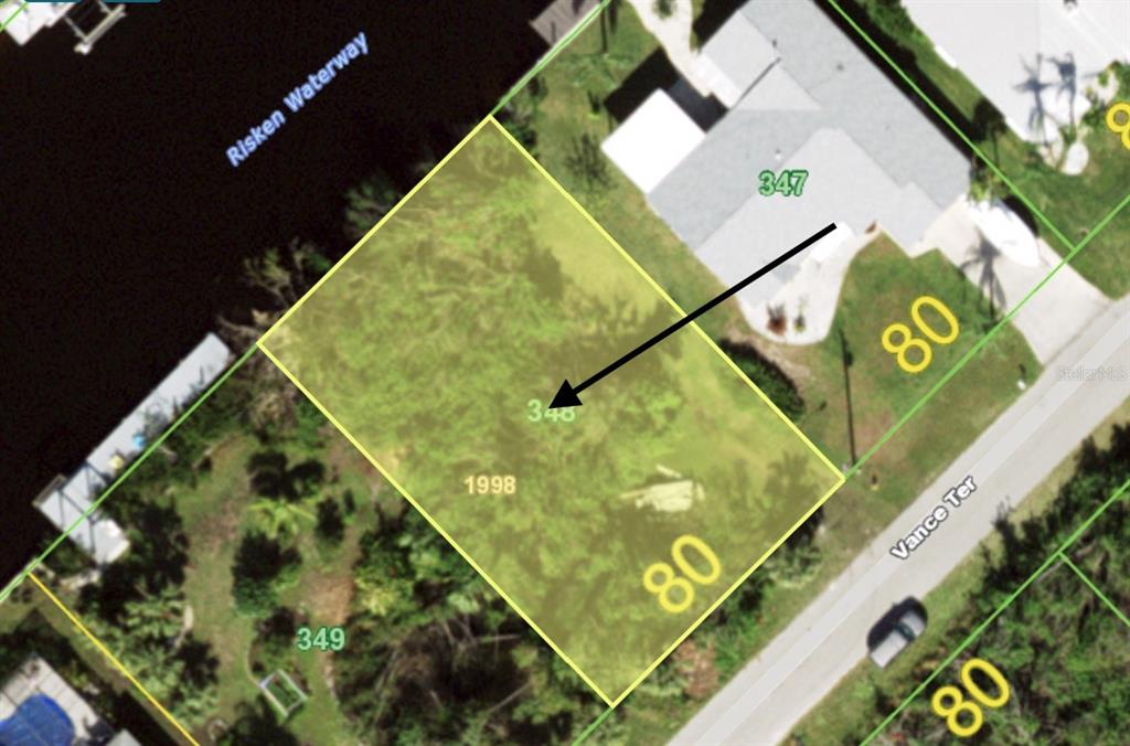 This is an aerial map showing a vacant residential lot bordering a waterway — 2425 VANCE TERRACE, PORT CHARLOTTE, FL
