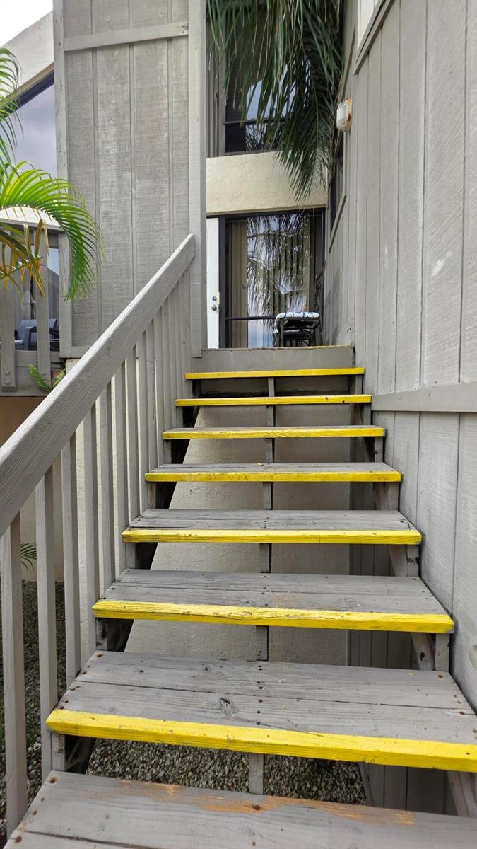 An exterior view of a teal front door with a welcome sign and mat — 1605 S Us Highway 1, Jupiter FL 33477, JUPITER, FL