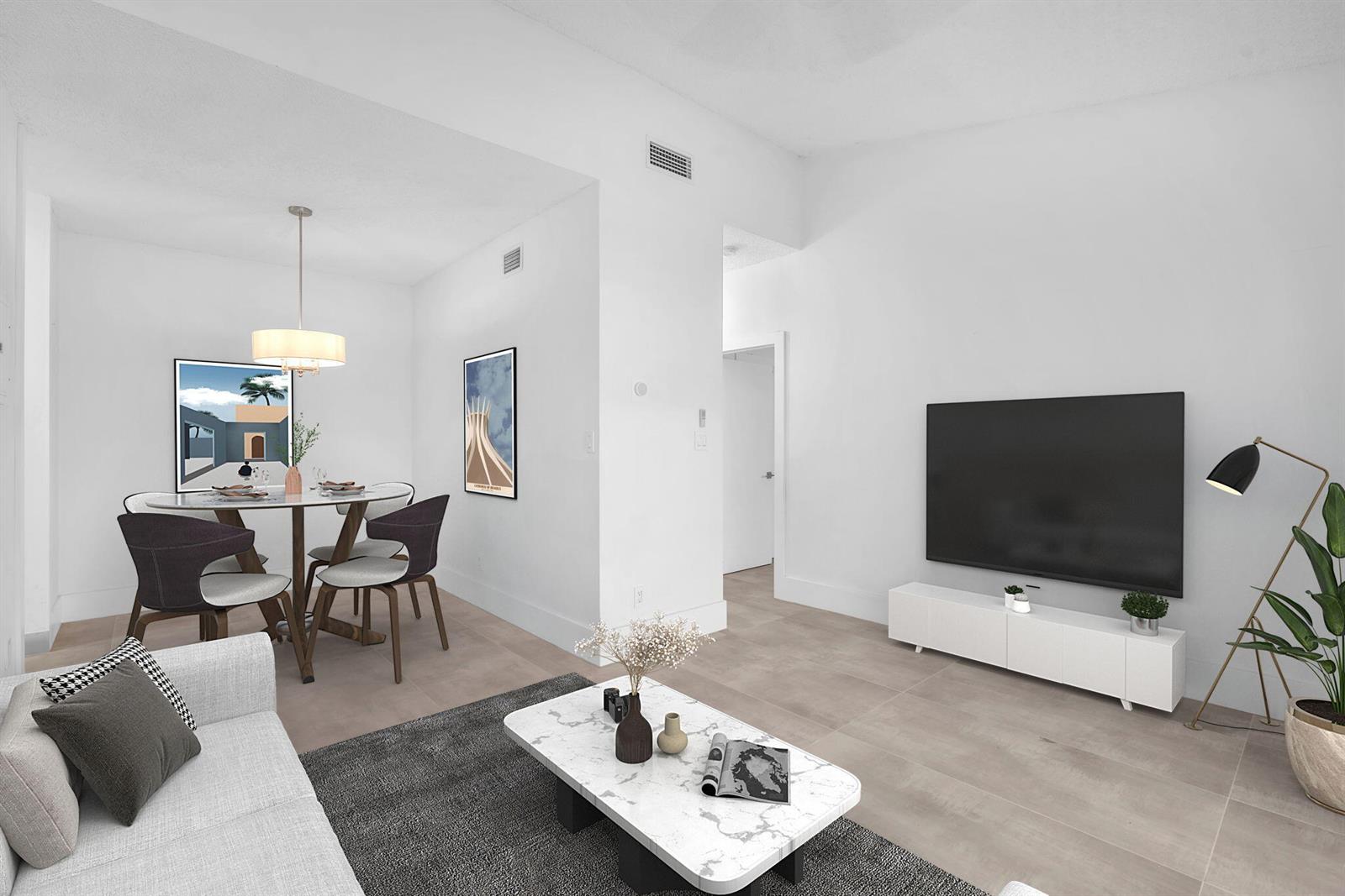 A living room and dining area with white walls, tile floors, and modern furniture — 671 Cypress Lake Boulevard # L21, Deerfield Beach FL 33064, DEERFIELD BEACH, FL