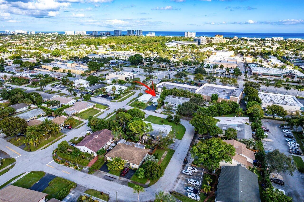 An aerial view shows a residential neighborhood with a red arrow pointing to a house — 262 SE 9th Avenue # 4, Deerfield Beach FL 33441, DEERFIELD BEACH, FL