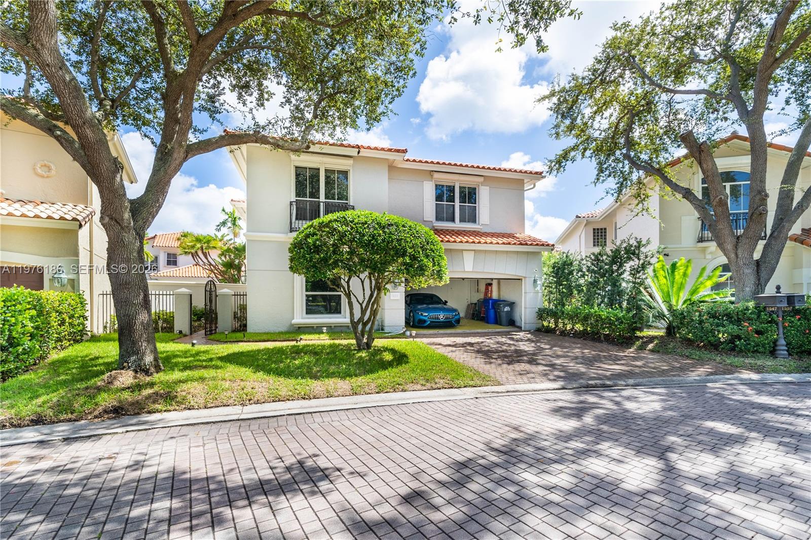 A two-story suburban house with a tiled roof, a garage, and a paved driveway — 1547 Mariner Way, Hollywood FL 33019, HOLLYWOOD, FL