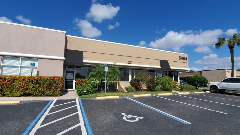 A single-story commercial building with a parking lot and a handicap-accessible parking space — 5404 HOOVER BOULEVARD UNIT 5, TAMPA, FL