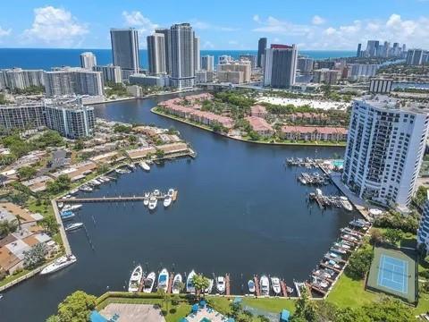 An aerial view of a marina with docked boats surrounded by high-rise buildings and residential complexes — 2500 Parkview Drive # 814, Hallandale Beach FL 33009, HALLANDALE BEACH, FL