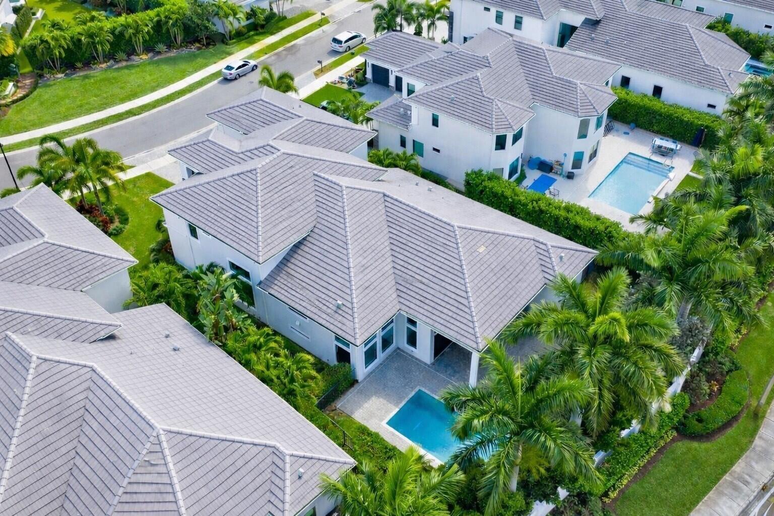 An aerial view of a white suburban house with a gray tile roof and pool — 6980 NW 28th Avenue, Boca Raton FL 33496, BOCA RATON, FL