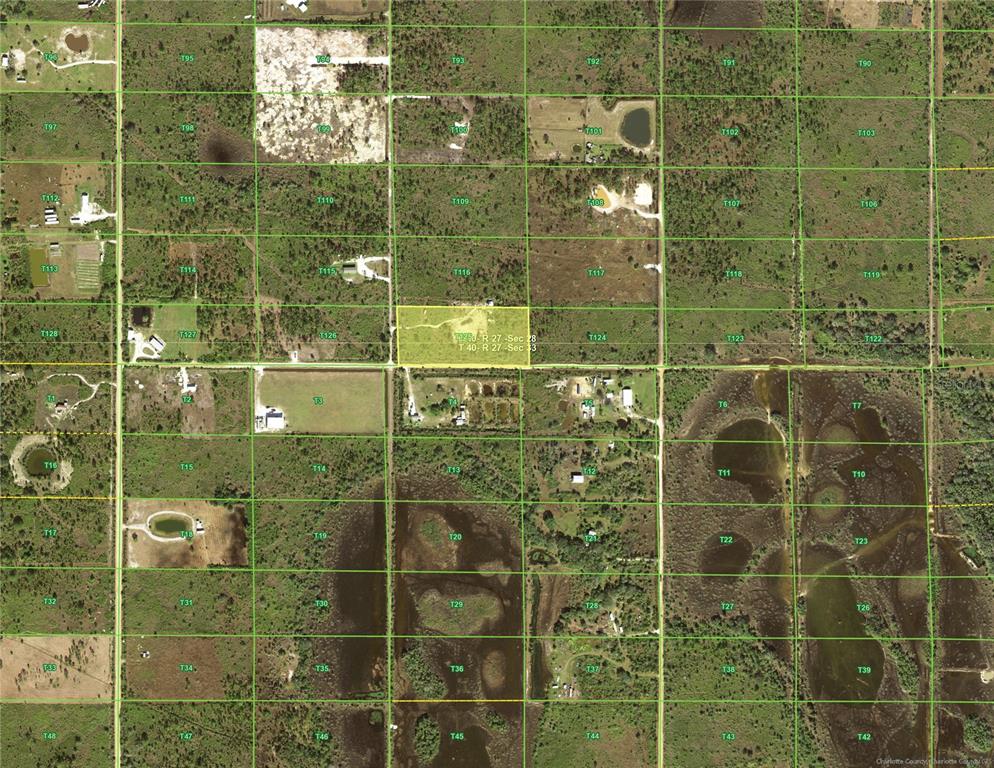 This is an aerial map showing a highlighted rectangular land parcel divided by grid lines — 50404 BERMONT ROAD, PUNTA GORDA, FL