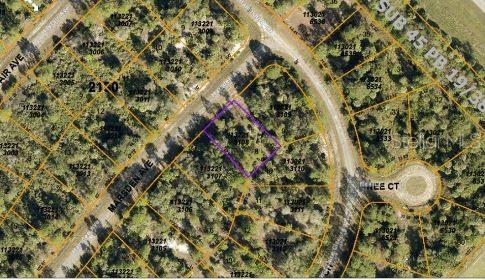 This is an aerial map showing a highlighted vacant lot in a residential neighborhood — MARSDEN AVENUE, NORTH PORT, FL