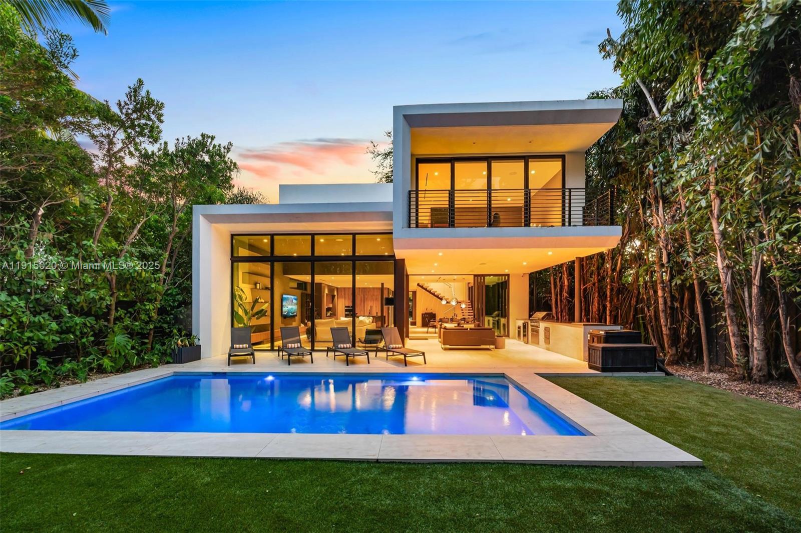 A modern two-story house features a swimming pool, patio, and floor-to-ceiling glass walls — 77 SW 18th Terrace, Miami FL 33129, MIAMI, FL