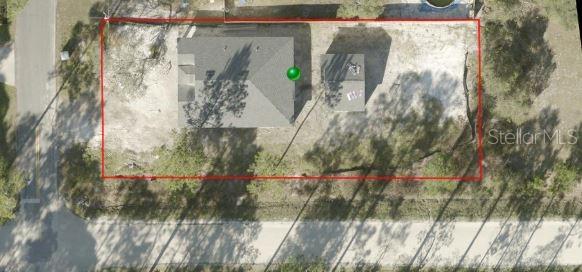 An aerial view shows a house and a detached shed on a rectangular lot — 1214 7TH AVENUE, DELAND, FL
