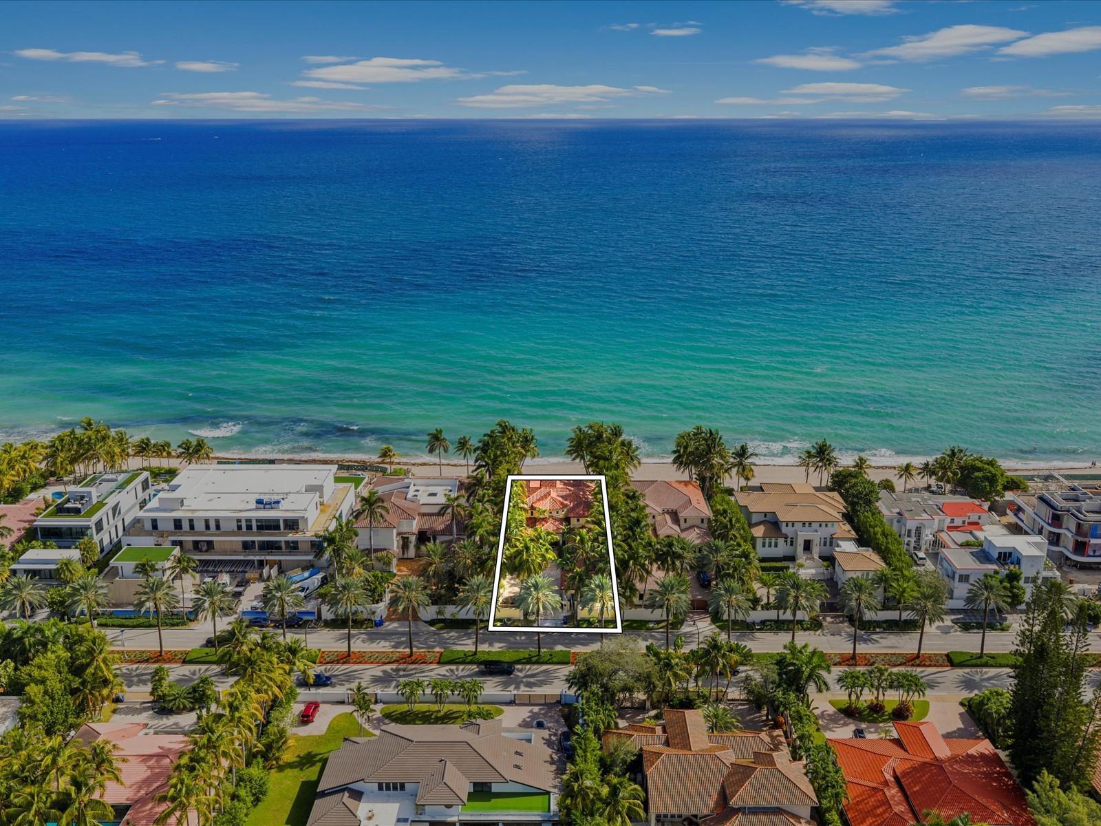 An aerial view shows a beachfront property outlined in white, surrounded by palm trees — 555 Ocean Boulevard, Golden Beach FL 33160, GOLDEN BEACH, FL
