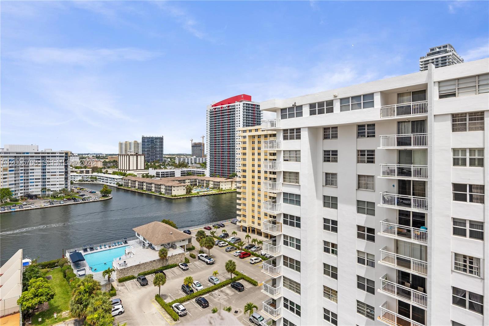 An elevated view shows a waterfront apartment complex with a pool and parking lot — 1865 S Ocean Dr # 15B, Hallandale Beach FL 33009, HALLANDALE BEACH, FL
