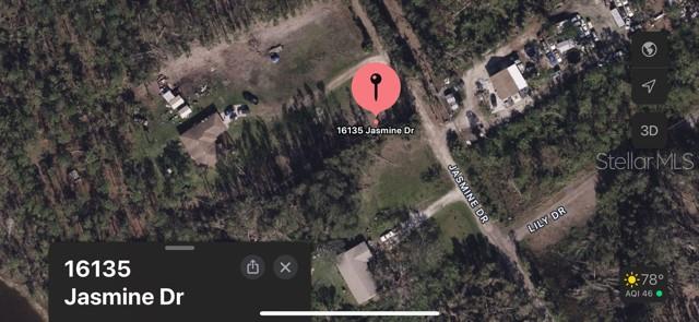This is a satellite map view showing a residential property with a pin on Jasmine Drive — 16135 JASMINE DRIVE, PUNTA GORDA, FL