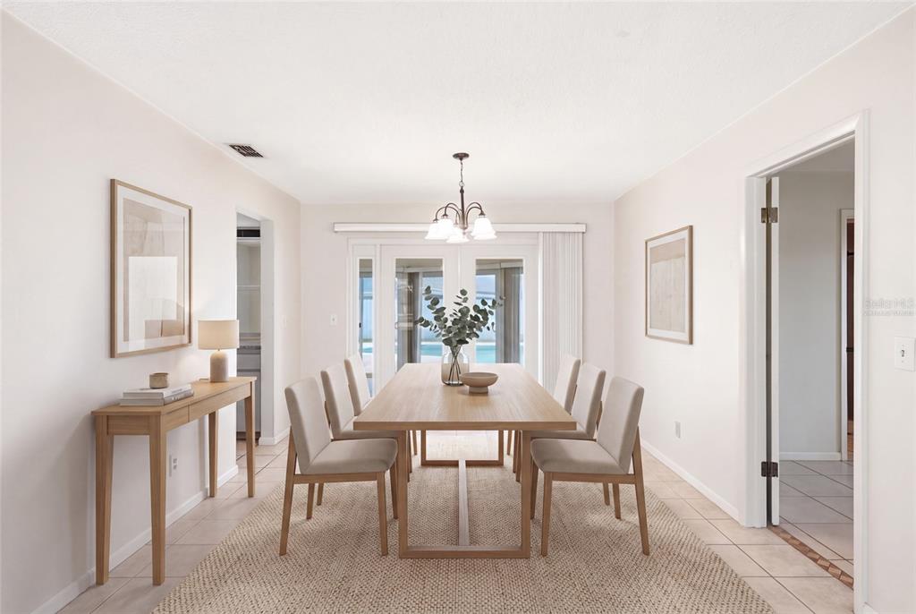 A dining room features a wooden table with six chairs, a console table, and tile flooring — 13219 RIDGE ROAD, LARGO, FL
