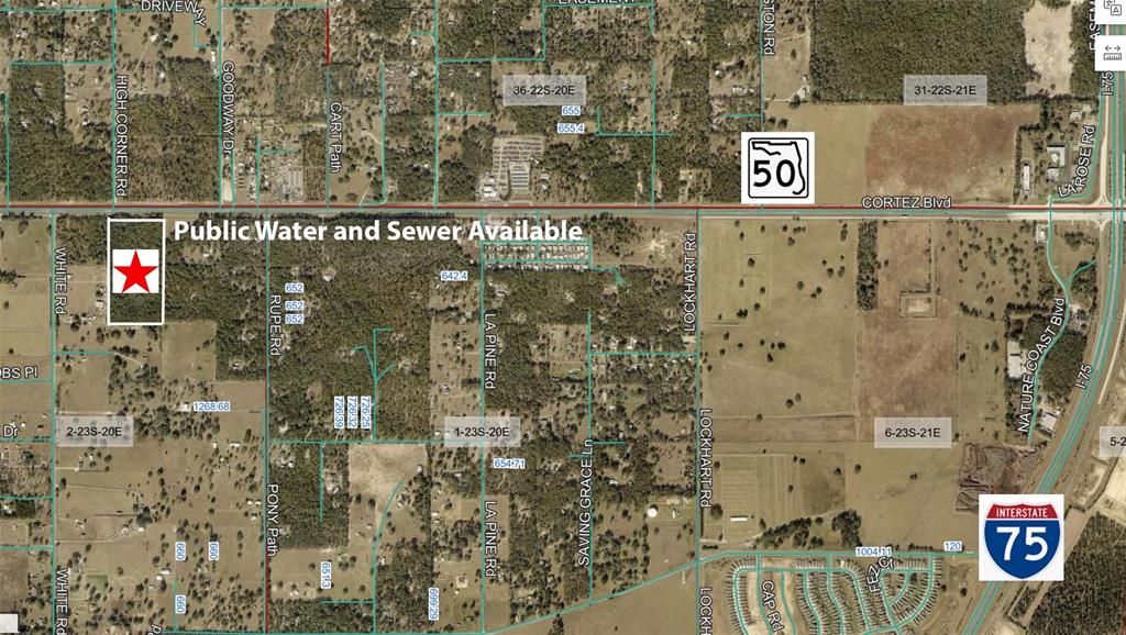 This is an aerial map showing a plot of land marked with a red star — CORTEZ BOULEVARD, BROOKSVILLE, FL