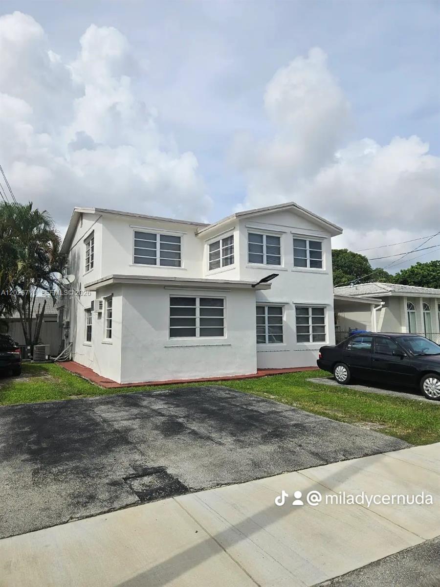 A two-story white house with a flat roof and a paved driveway in front — 3431 SW 4th St # 1, Miami FL 33135, MIAMI, FL