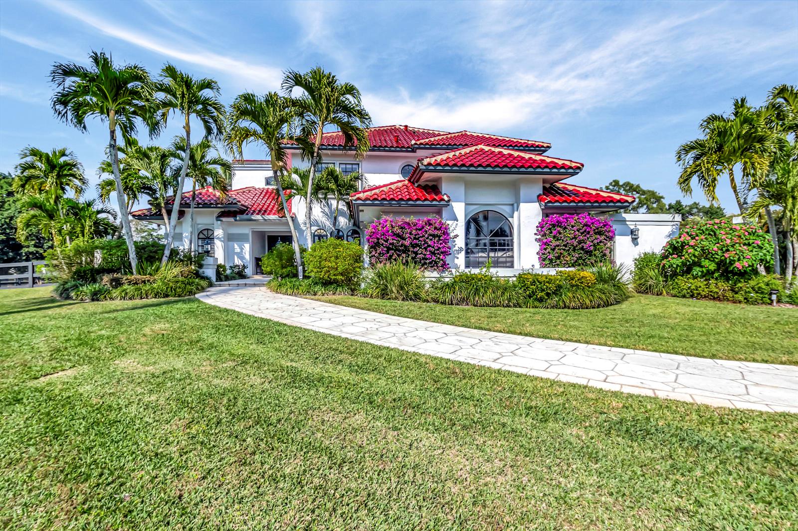 A two-story white house with a red tile roof and palm trees on a lawn — 10321 El Paraiso Place S, Delray Beach FL 33446, DELRAY BEACH, FL