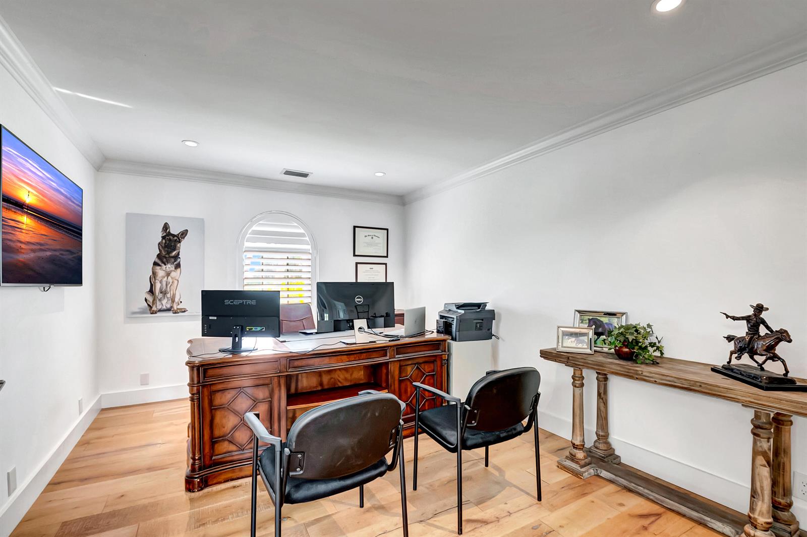 A home office features a wooden desk, two black chairs, and a console table — 10321 El Paraiso Place S, Delray Beach FL 33446, DELRAY BEACH, FL