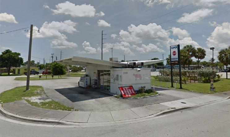A small, single-story commercial building with a flat roof and a paved parking lot — 4420 NE 1ST TERRACE, OAKLAND PARK, FL